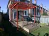 New backyard with deck and arbor from lawn